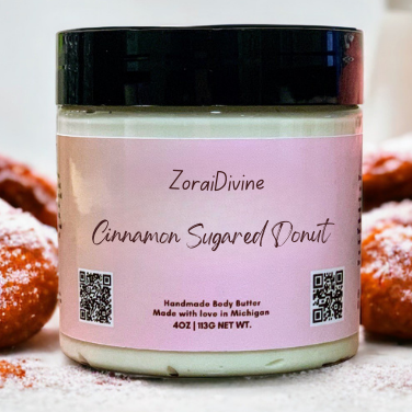 ZoraiDivine Cinnamon Sugared Donut body butter jar with donuts in the background