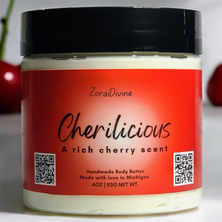 Jar of 'Cherilicious' body butter with cherries in the background