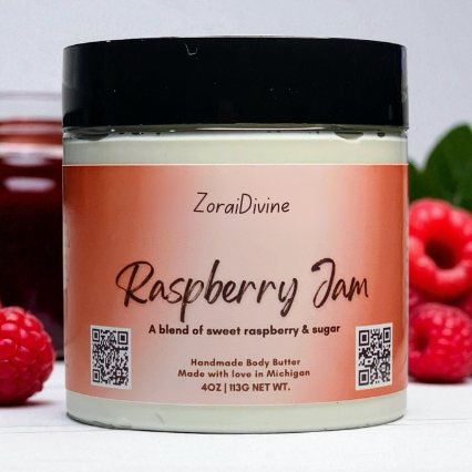 Jar of ZoraiDivine Raspberry Jam body butter with raspberries in the background