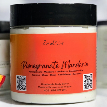 Jar of ZoraiDivine Pomegranate Mandarin body butter with an orange label.