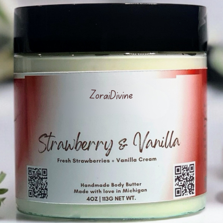 Jar of strawberry and vanilla body butter with strawberries on a white background