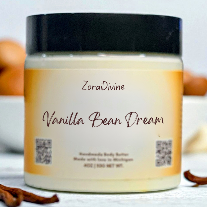 Jar of ZoraiDivine Vanilla Bean Dream body butter with vanilla beans and cinnamon sticks in the background.