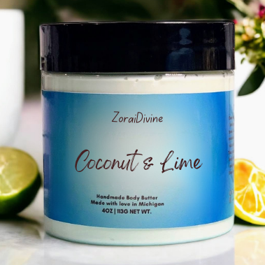 ZoraiDivine Coconut & Lime body butter jar with fruits in the background
