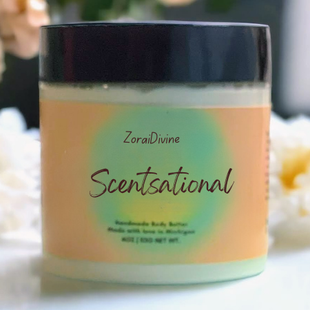 Jar of ZoraiDivine Scentsational body butter with a blurred background