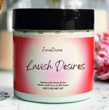 ZoraiDivine Lavish Desires body butter jar on a blurred background