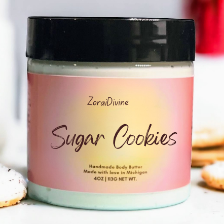 Jar of ZoraiDivine Sugar Cookies body butter with a pink label.