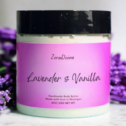Jar of ZoraiDivine Lavender & Vanilla body butter with purple flowers in the background