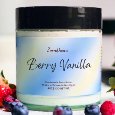Jar of ZoraiDivine Berry Vanilla body butter with berries in the background