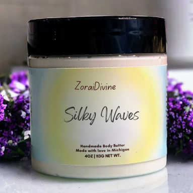 ZoraiDivine Silky Waves body butter jar with a black lid on a light background