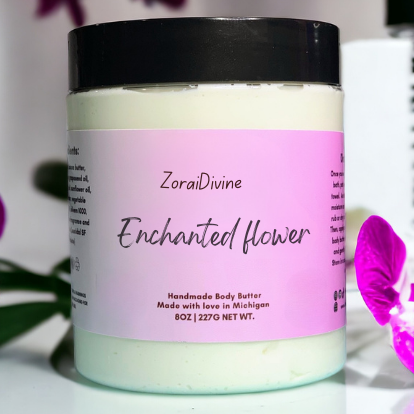 ZoraiDivine Enchanted Flower body butter jar with a pink label on a blurred background