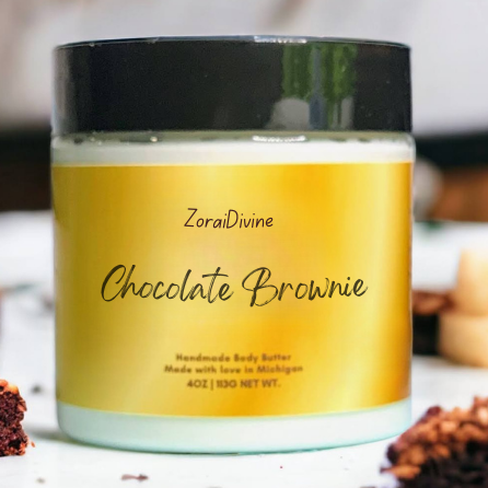 Jar of ZoralDivine Chocolate Brownie body butter on a blurred background