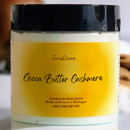 Jar of ZoraiDivine Cocoa Butter Cashmere body butter with a yellow label.