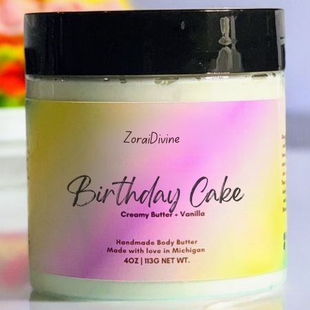 Jar of ZoraiDivine Birthday Cake body butter with a colorful label.