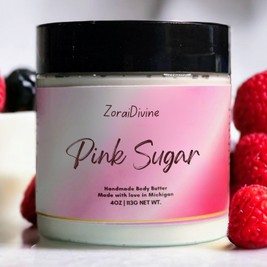 Jar of ZoraiDivine Pink Sugar body butter with raspberries on a light background