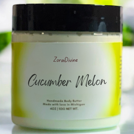 Jar of ZoraiDivine Cucumber Melon body butter with cucumbers in the background