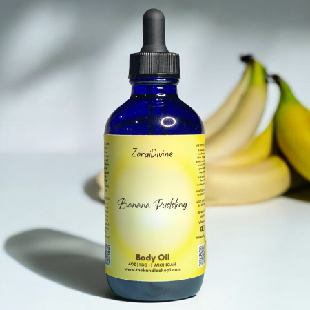 Bottle of ZoraiDivine Banana Pudding body oil with bananas in the background