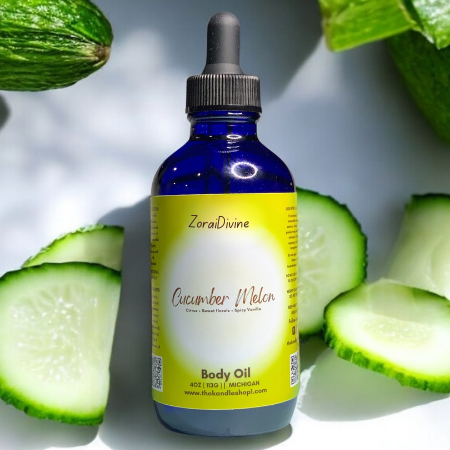 Bottle of ZoraiDivine Cucumber Melon Body Oil with sliced cucumbers in the background