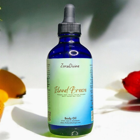 Bottle of ZoraiDivine Island Breeze body oil with a dropper on a light background