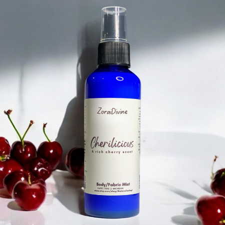 Body mist Cherilicous with cherries on a white background
