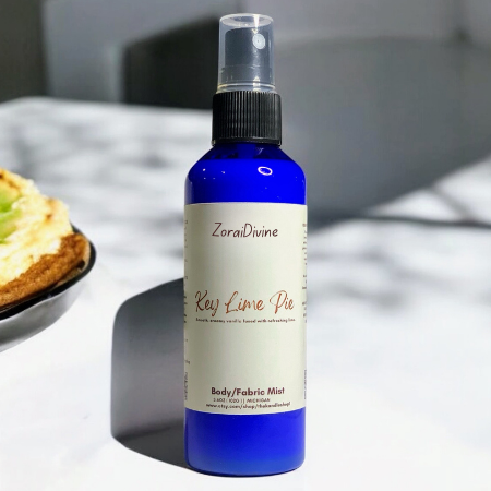 Body mist Key Lime Pie with a key lime pie on a plate in the background.