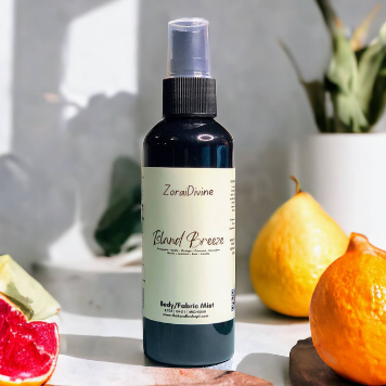 Body mist Island breeze on a table with fruits and plants