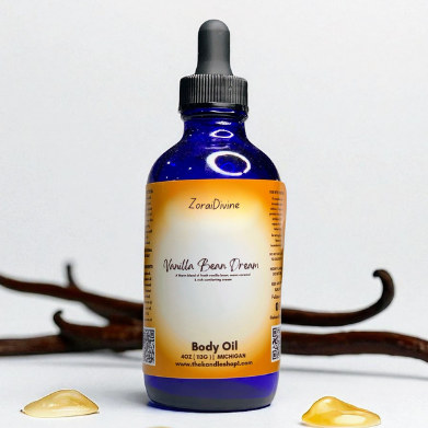 Bottle of ZoraiDivine Vanilla Bean Dream body oil with a dropper on a light background.