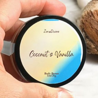 Zora Divine Coconut & Vanilla body butter container held by a hand with a coconut in the background.