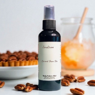 Body mist Caramel pecan pie surrounded by pecans and a pecan pie.