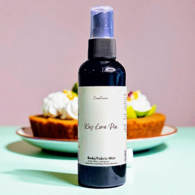 Body mist Key lime pie on a white counter with key lime pie in the background.