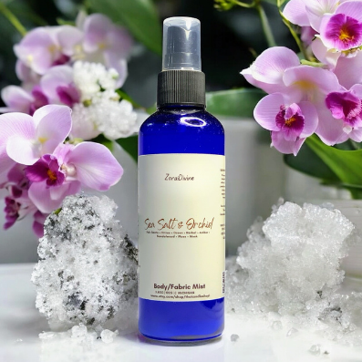 Body mist Sea salt & orchid with orchids & sea salt on the background.