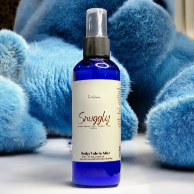 Body mist 'Snuggly' with blue fuzzy plushies in the background