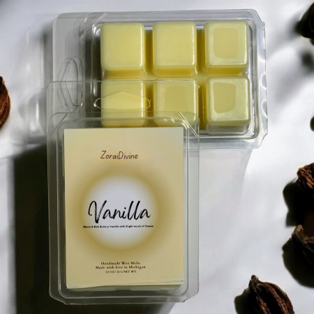 Pack of vanilla-scented wax melts with vanilla beans on a white background