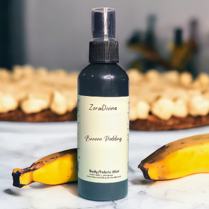 Body mist Banana pudding on a white background with bananas around the bottle