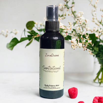 Body mist Scentsational with raspberries and flowers on a light background